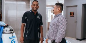 Urban Clean franchisee shaking hands with a client.